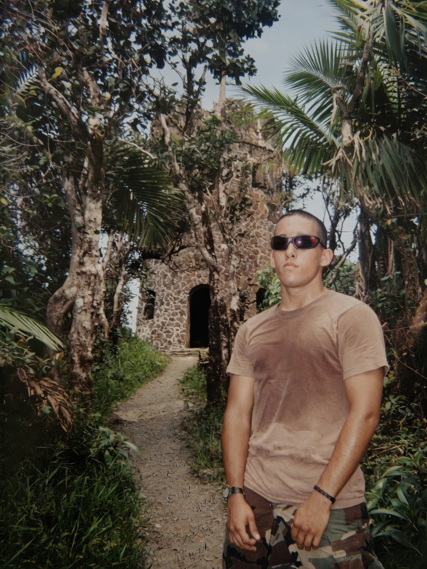 Commander in jungle environment, sunglasses, Army fatigues — field training still