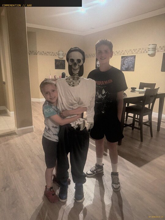 Junior agents posing with the skeleton they allegedly caught