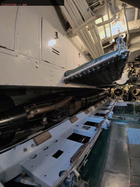 Torpedo loading tube and torpedo aboard the submarine