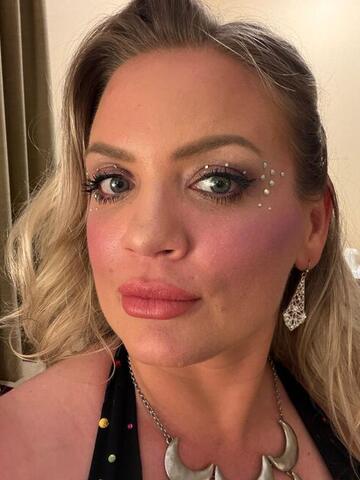 Close-up portrait of Night Shade with styled hair and evening make-up
